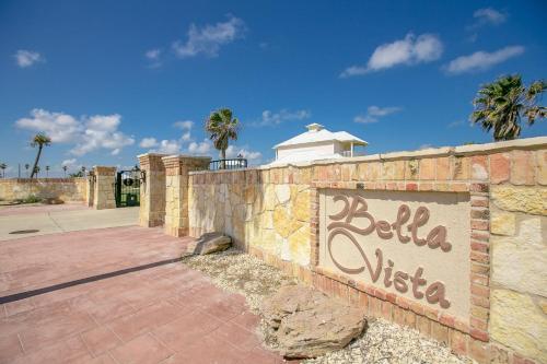 a brick wall with a sign for aella villa at Bella Vista & Four Winds House in Padre Island
