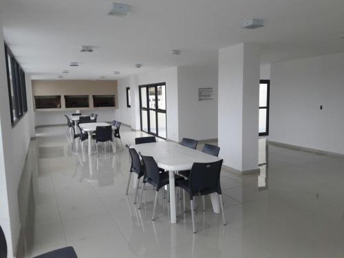 a group of tables and chairs in a room at Apartamento Esquiu C in Villa Carlos Paz