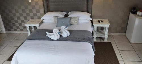 Letto o letti in una camera di Rockview Lodge