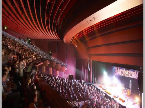 an empty auditorium with people sitting in the audience at Crown Promenade Perth in Perth