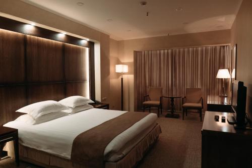 Een bed of bedden in een kamer bij Hotel Sagaan Morin
