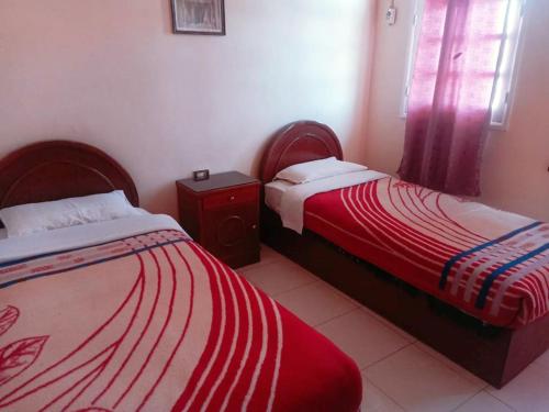 Una cama o camas en una habitación de Amenophis Hotel