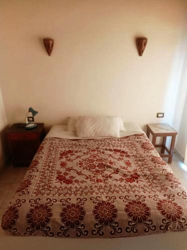 Una cama o camas en una habitación de Amenophis Hotel
