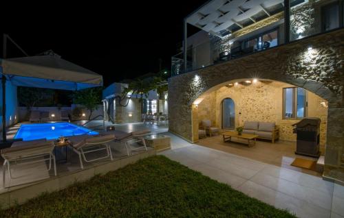 a house with a swimming pool at night at Casa di Grimpili in Kolymvari