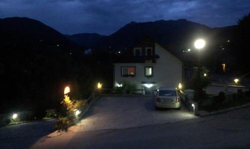 a car parked in front of a house at night at Private accommodation Lidija Rakočević in Kolašin