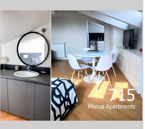 Habitación con mesa, espejo y baño. en Monza Apartments, en Monza