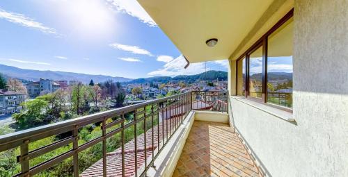 a balcony with a view of a city at Troyan Plaza Hotel in Troyan