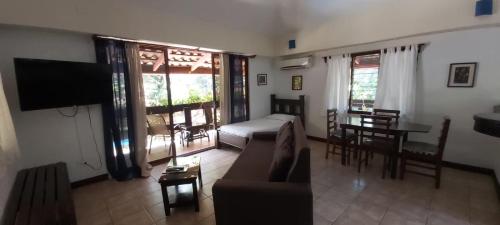 a living room with a couch and a table at Massai Apartments in Playa Flamingo