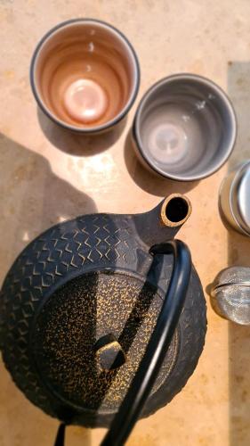 a pair of scissors sitting on a table next to bowls at Short stay Midden Drenthe in Beilen
