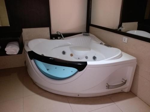 a bath tub with a shark face painted on it at Holiday Home Ranchi in Rānchī