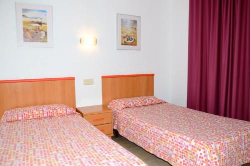 Postel nebo postele na pokoji v ubytování Nautic 1-2