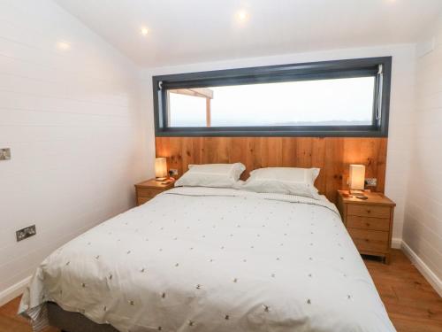 מיטה או מיטות בחדר ב-Stables Lodge
