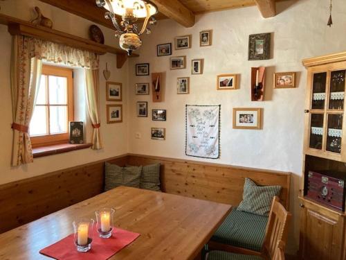 a dining room with a wooden table and chairs at Kellerstöckl Postrumer Weinberg 49 in Kulm im Burgenland
