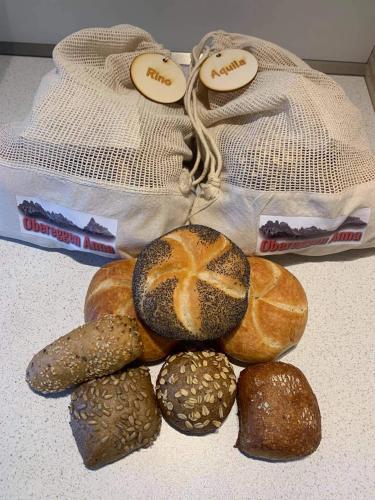 a pile of different types of bread on a table at Obereggen - Anna in Eggen