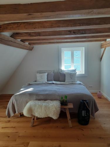 a bedroom with a large bed in a attic at BEAS WOHNEN in Sinsheim
