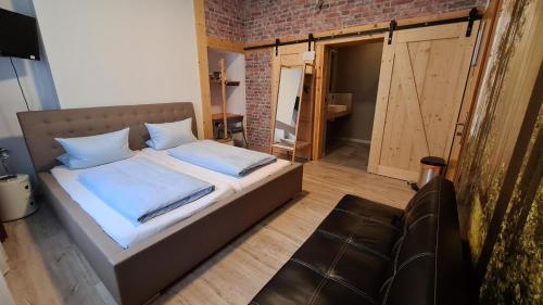Postel nebo postele na pokoji v ubytování Hotel Aleo