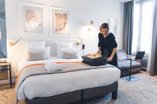 Oceania Hôtel d'Anjou Angersにあるベッド
