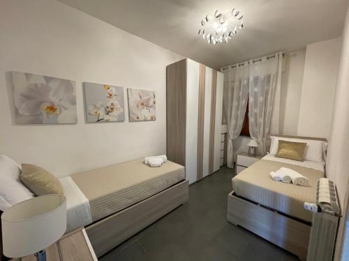 En eller flere senge i et værelse på Profumi di Mare