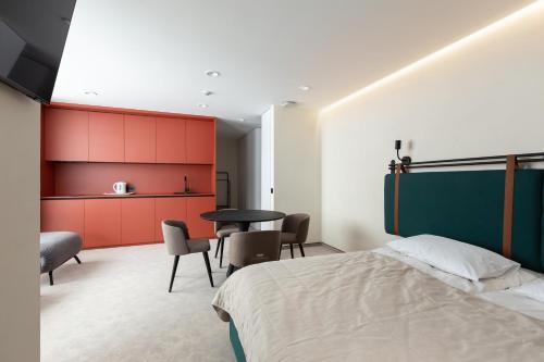 Postel nebo postele na pokoji v ubytování HVOYA Apart-Hotel & SPA