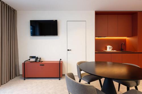 TV a/nebo společenská místnost v ubytování HVOYA Apart-Hotel & SPA