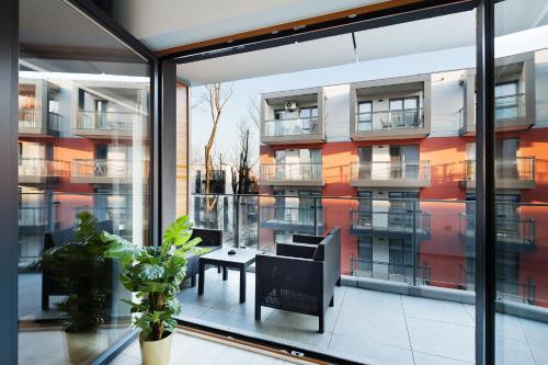 an apartment balcony with a view of a building at Central Apartments by Bed&Bath in Kraków