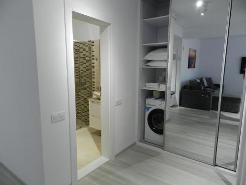 a laundry room with a washer and dryer at AP RELAX Tulcea in Tulcea