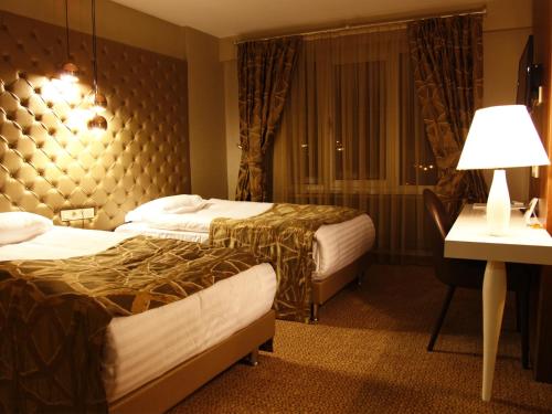 Posteľ alebo postele v izbe v ubytovaní Feyzan Hotel