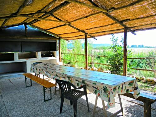 a table and chairs on a patio with a view at Agriturismo Camera dei ladri in Marsiliana