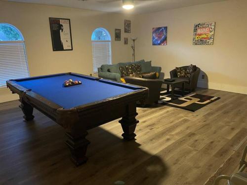 a living room with a pool table in it at The Brick House in McAllen