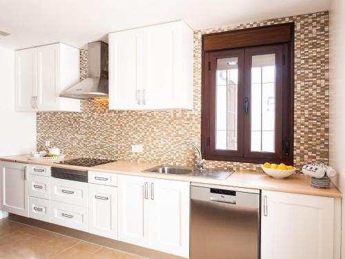 Η κουζίνα ή μικρή κουζίνα στο Ronda Home