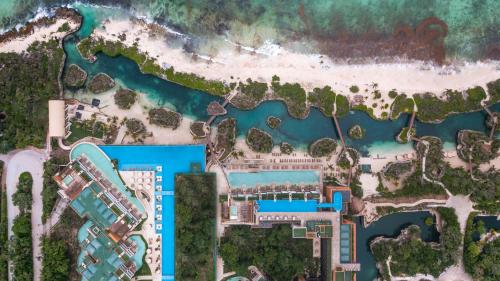 a plan of the resort with the beach and water at Hotel Xcaret Arte - All Parks All Fun Inclusive - Adults Only in Playa del Carmen