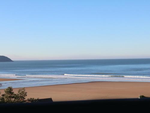 a view of a beach with the ocean at Beach Lodge in Woolacombe