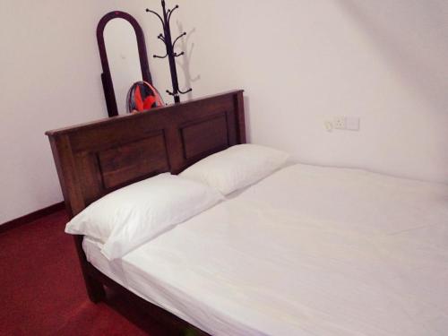 Ένα ή περισσότερα κρεβάτια σε δωμάτιο στο Wilpattu Gagana guest