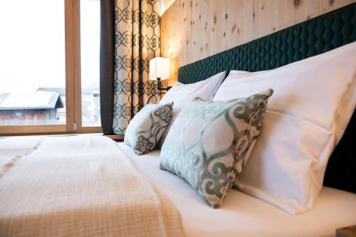 Una cama o camas en una habitación de Natur Resort RISSBACHER