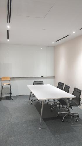 an empty room with a white table and chairs at MCity Jalan Ampang KLCC in Kuala Lumpur