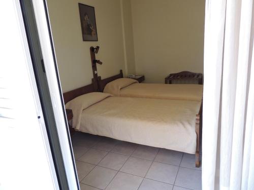 a bedroom with two beds in a room at Miami Studios in Loutra Edipsou