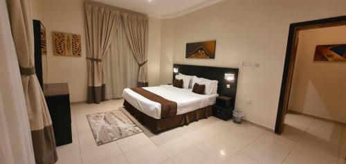 En eller flere senge i et værelse på Nawara AL ASKARY