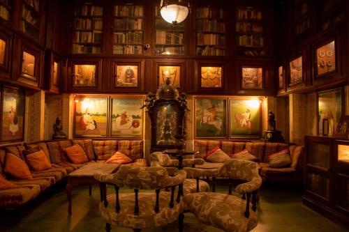 a living room with a couch and couches at Hotel Bissau Palace in Jaipur