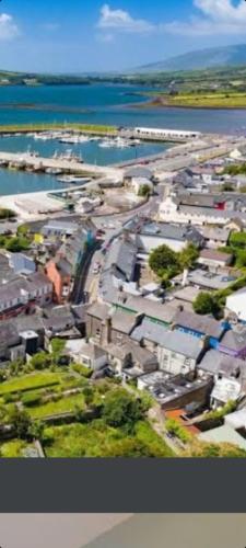 an aerial view of a city with buildings and the water at Baywatch Inn in Dingle
