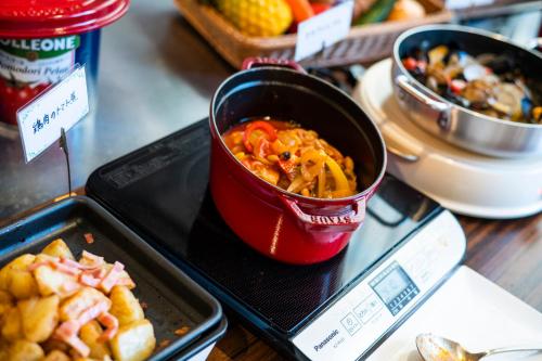 a cup of food on a tray on a table at Hiyori Hotel Osaka Namba Station in Osaka