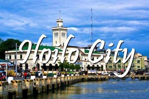 a large sign that says hollywood in front of a building at AVIDA ATRIA T2-C short walk mall,esplanade,wifi,netflix,kitchen,pool in Iloilo City