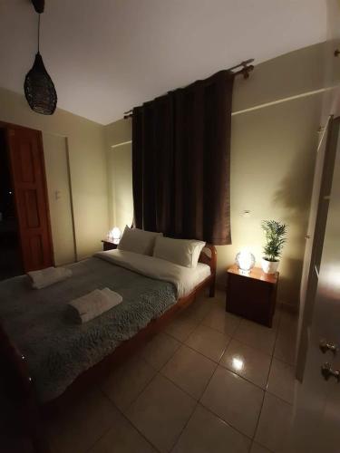 Postel nebo postele na pokoji v ubytování KERAMIDAKI MINI SUITES 4