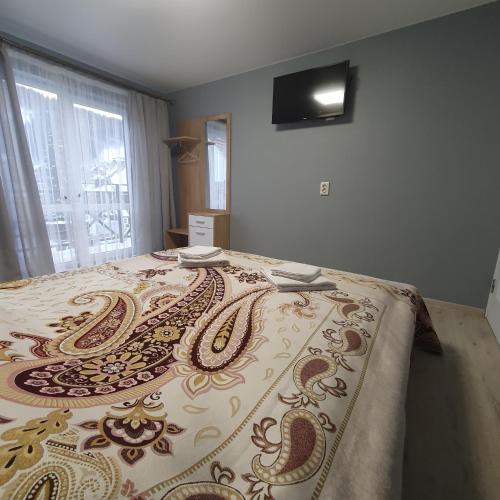 Ένα ή περισσότερα κρεβάτια σε δωμάτιο στο Melody Hotel