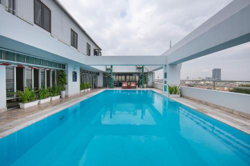 a swimming pool on the roof of a building at The Tray Hotel Hai Phong in Hai Phong