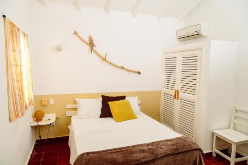 Katil atau katil-katil dalam bilik di Beach Hotel Casa Nina