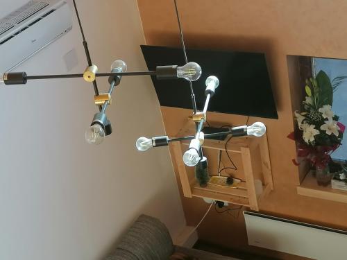a room with two lights hanging from a wall at Vila Mila Fruška Gora in Velika Remeta