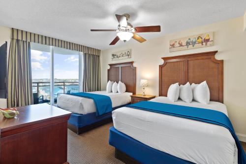 A bed or beds in a room at Ocean View Bahama Sands Stunning Resort
