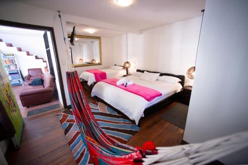 Cama o camas de una habitación en Hotel De Mi Pueblo