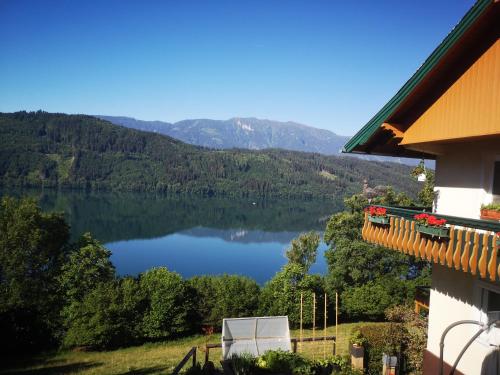 a view of a lake from a house at Ferienwohnungen Klinar in Millstatt