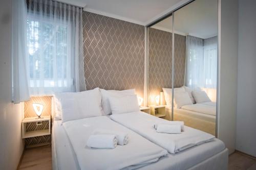 Posteľ alebo postele v izbe v ubytovaní MyFlat Diamond Bay Apartment